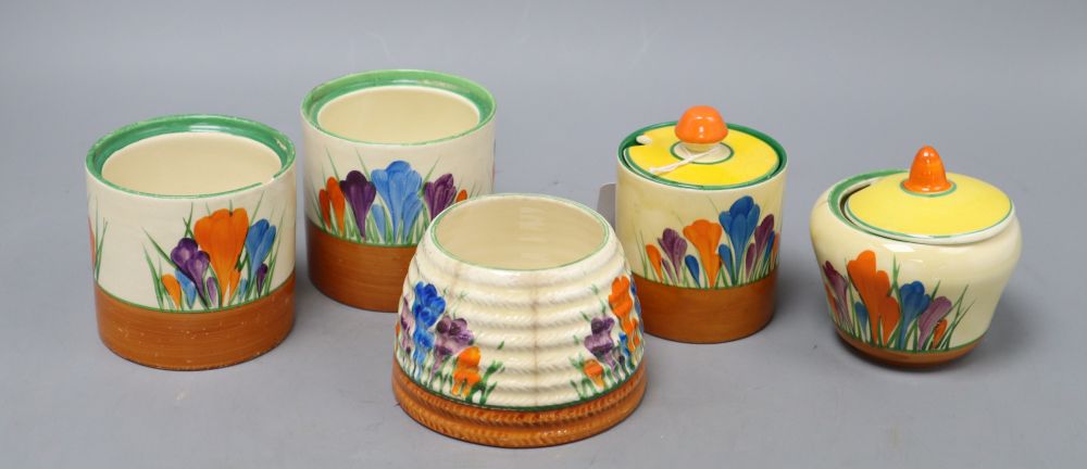 Five Clarice Cliff crocus preserve jars and two covers, tallest 8.5cm